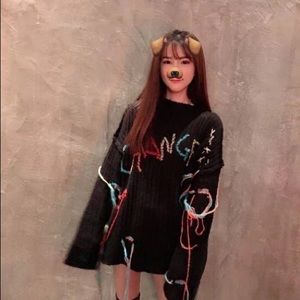 Sweater with asymmetric fringe